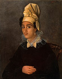 A Creole woman wearing a tignon.